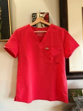 Figs Catarina One Pocket Scrub Top in the color Pride Hibiscus